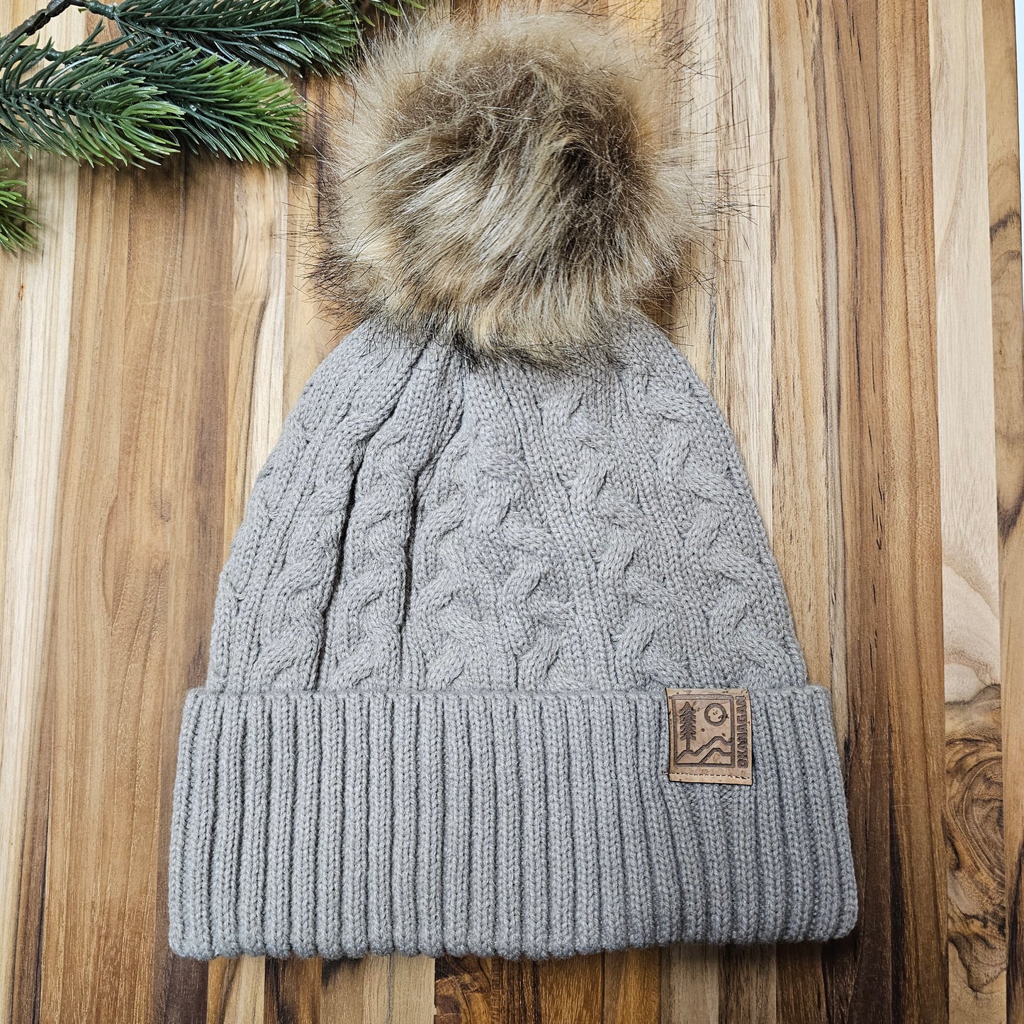 Okanagan Wild Cable Knit Toque with Faux Fur Pom and Cork Patch - Oatmeal