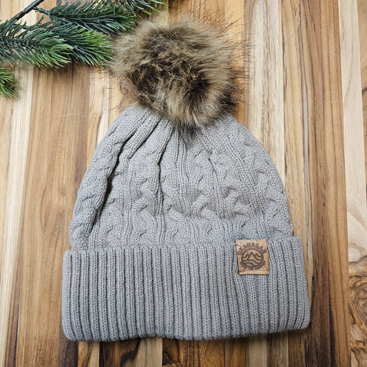 Okanagan Wave Cable Knit Toque in Oatmeal with Faux Fur Pom and Cork Patch